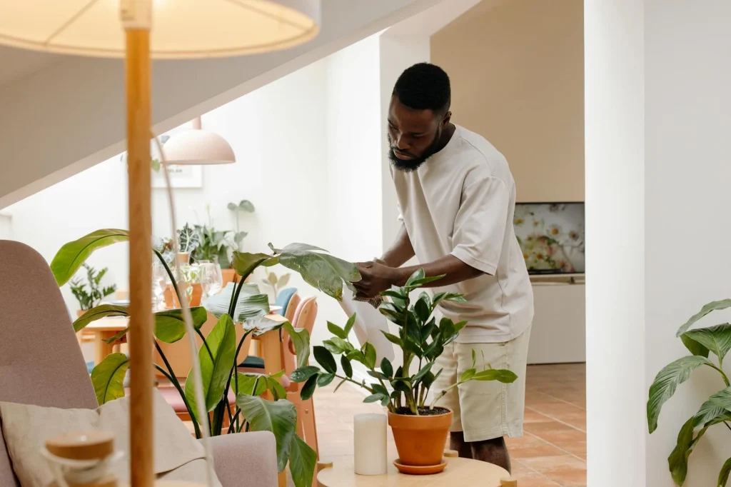 Woman adjusting a humidifier indoors to improve air quality and relaxation