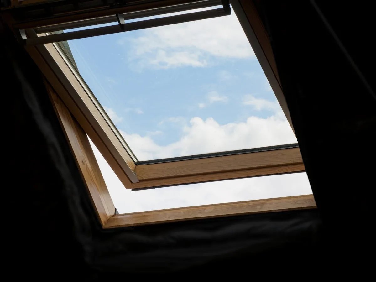 Open window letting fresh air into a room for natural ventilation