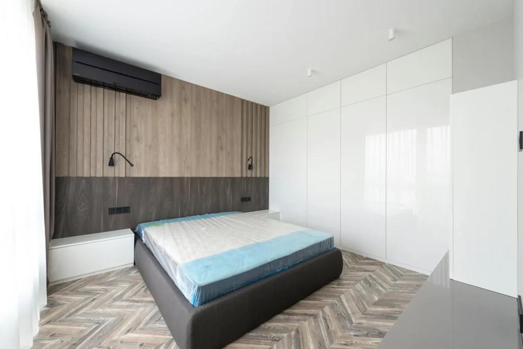 White tower air purifier in a clean bedroom