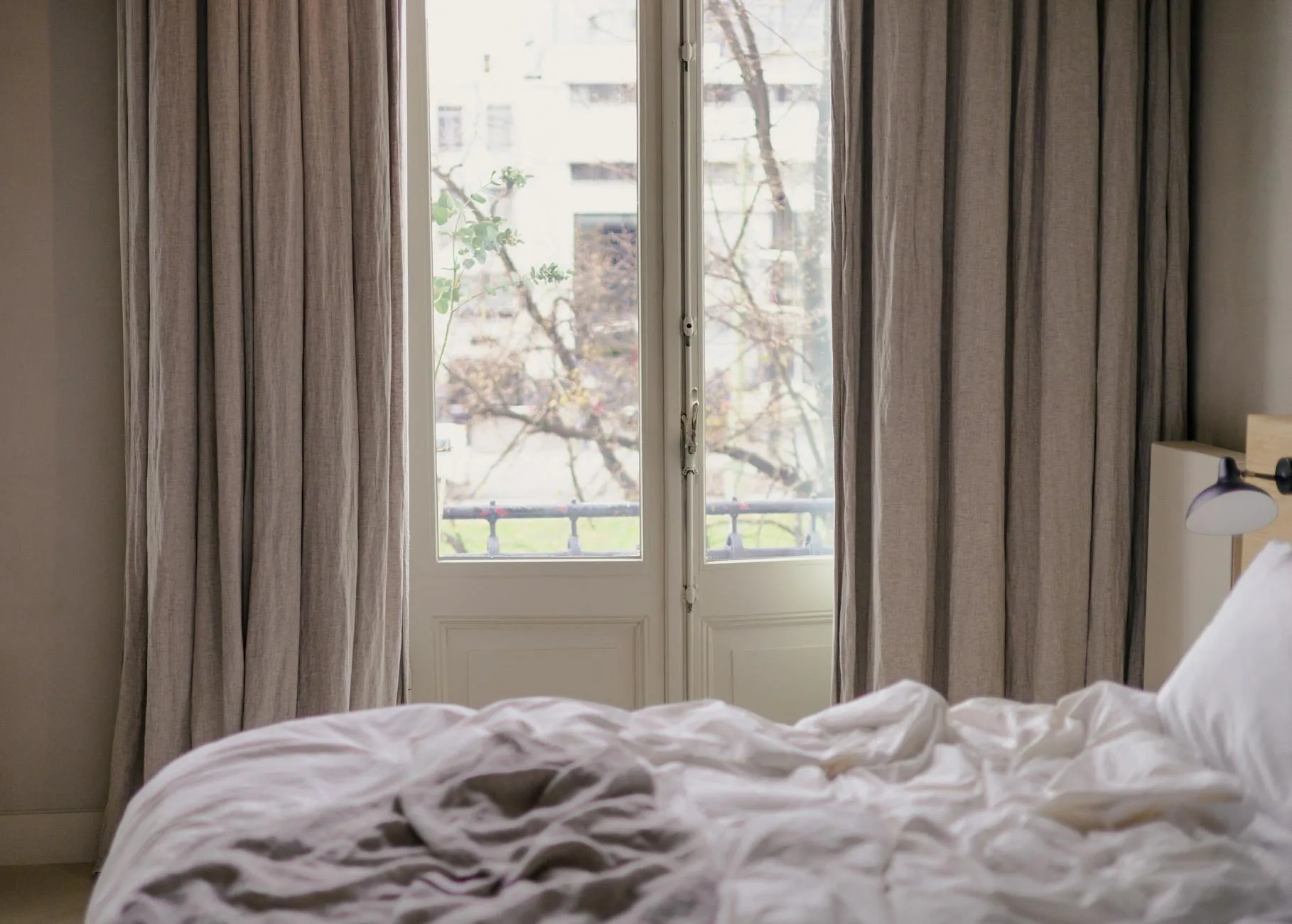 Open bedroom window letting in fresh morning air