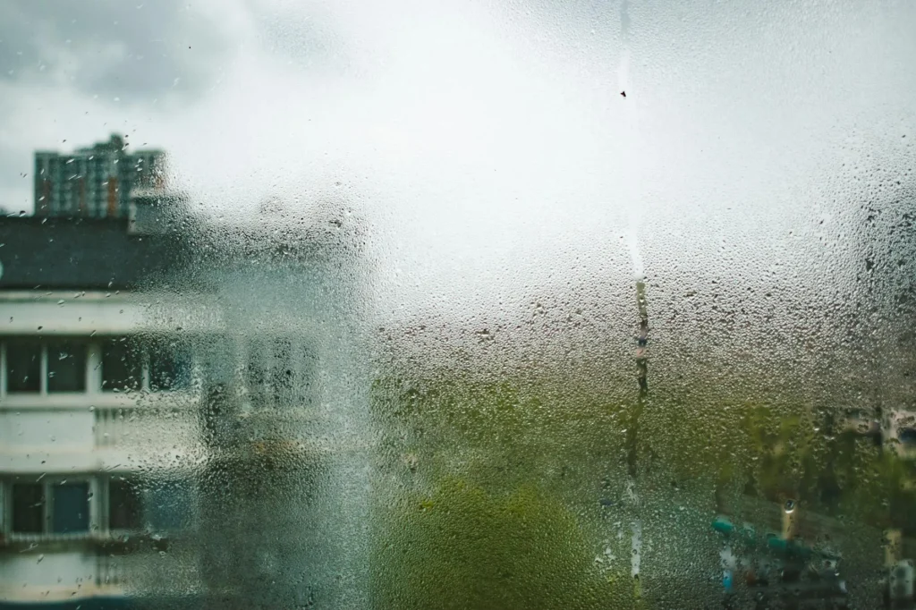 Condensation on flat window with morning light coming through