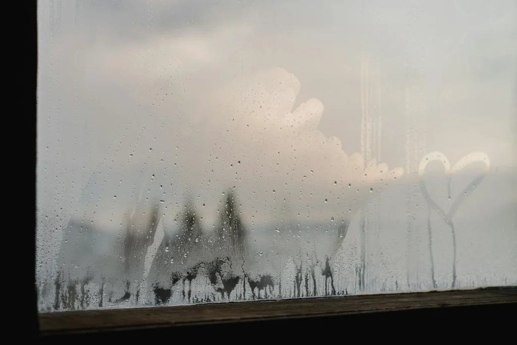 Condensation drops on a window on a cold winter morning