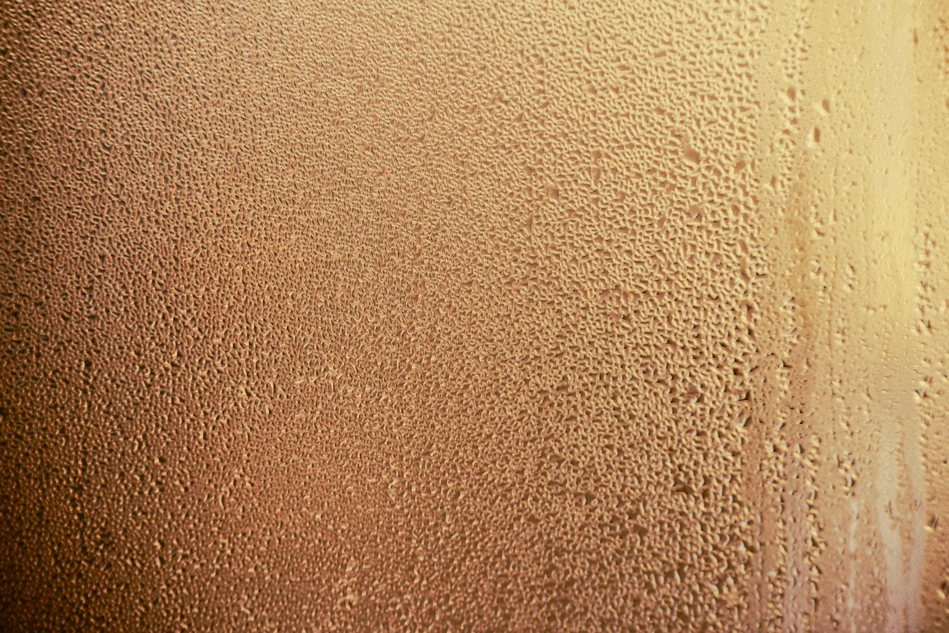 Condensation droplets forming on a glass window