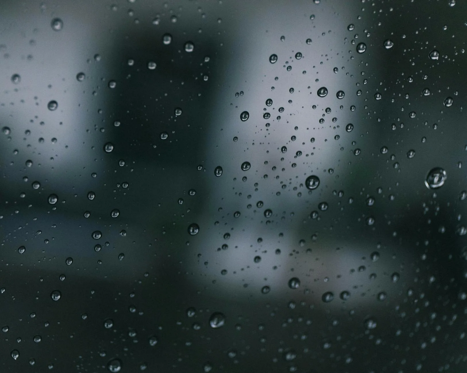 Condensation moisture drops forming on a window pane