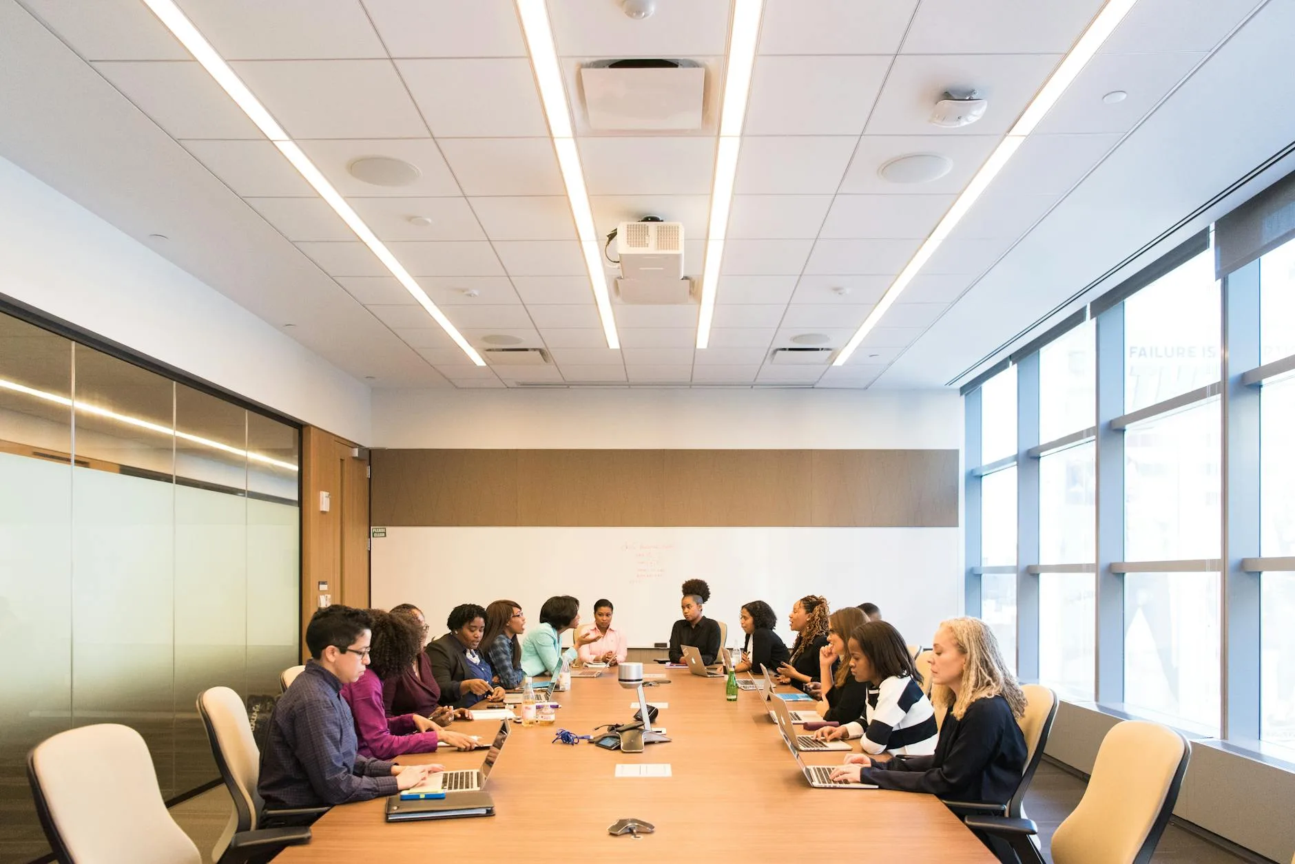 People in an office meeting room where CO2 levels can rise quickly