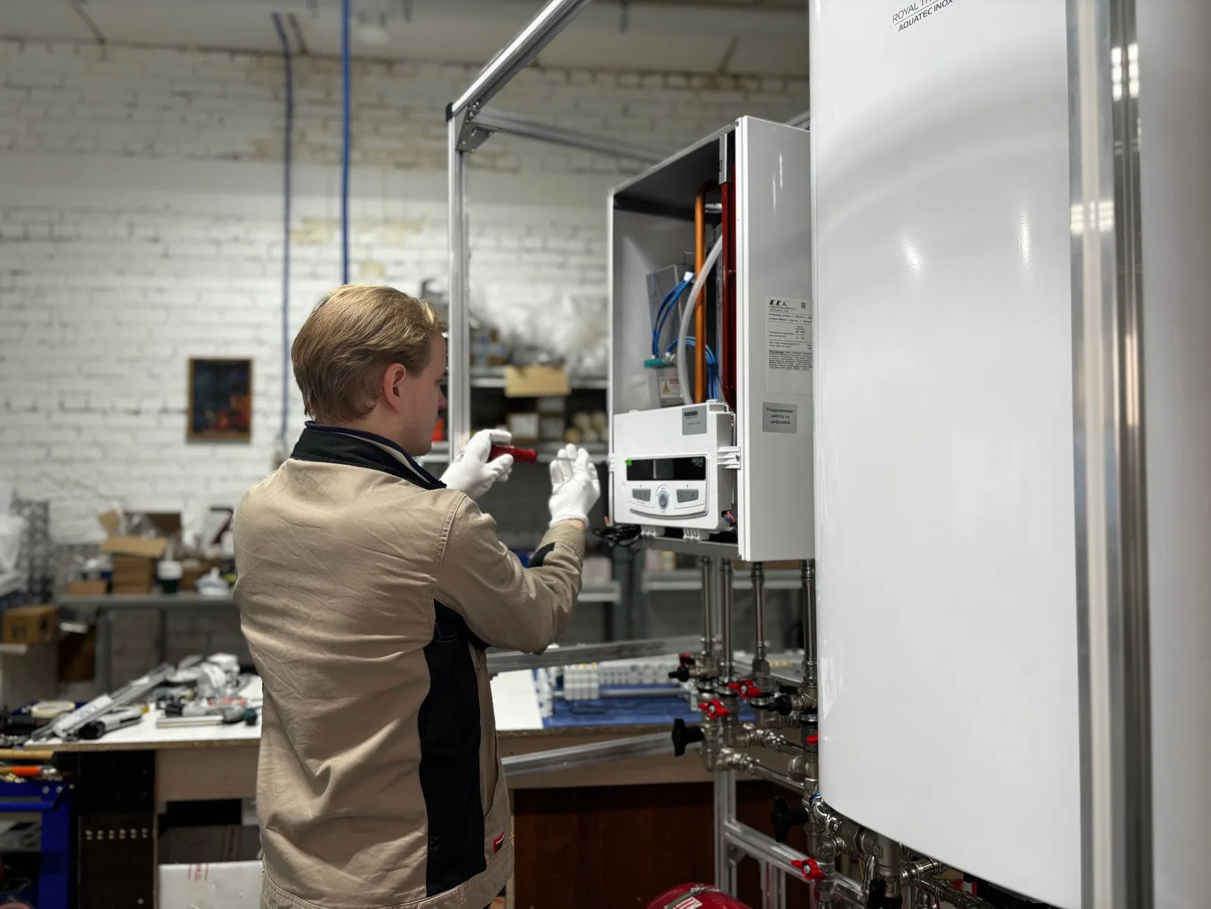 Engineer checking a domestic boiler where carbon monoxide alarms matter