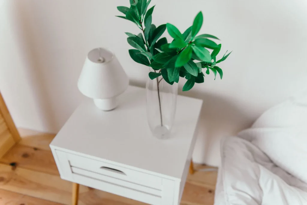 Cool mist humidifier running on a bedroom bedside table